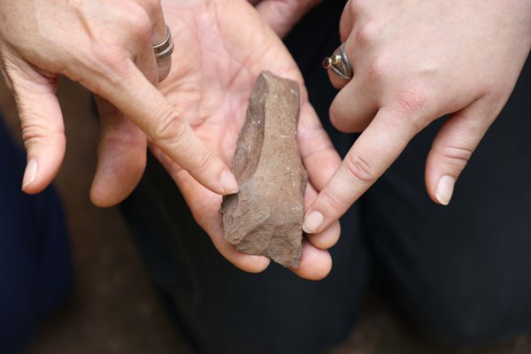 An archaeological dig on Norfolk Island has uncovered two Polynesian adzes (stone axes) and hundreds of flakes dating back to pre-European settlement.